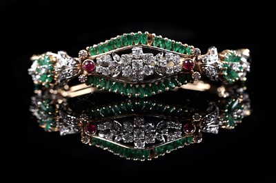 Lot 921 - An emerald, ruby and diamond bracelet