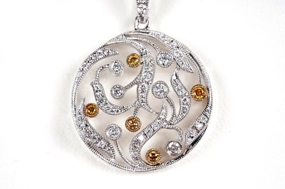 Lot 944 - A white and yellow diamond pendant necklace