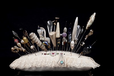 Lot 696 - A collection of hat and stick pins, including a 9ct gold leaf pattern pin