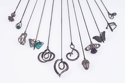 Lot 29 - A collection of ten Charles Horner silver hat pins; and two further similar