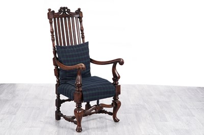 Lot 12 - A 17th Century style carved oak armchair