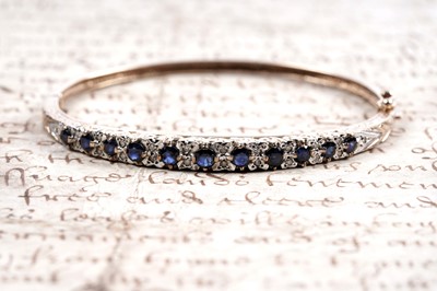 Lot 852 - A sapphire and diamond bangle