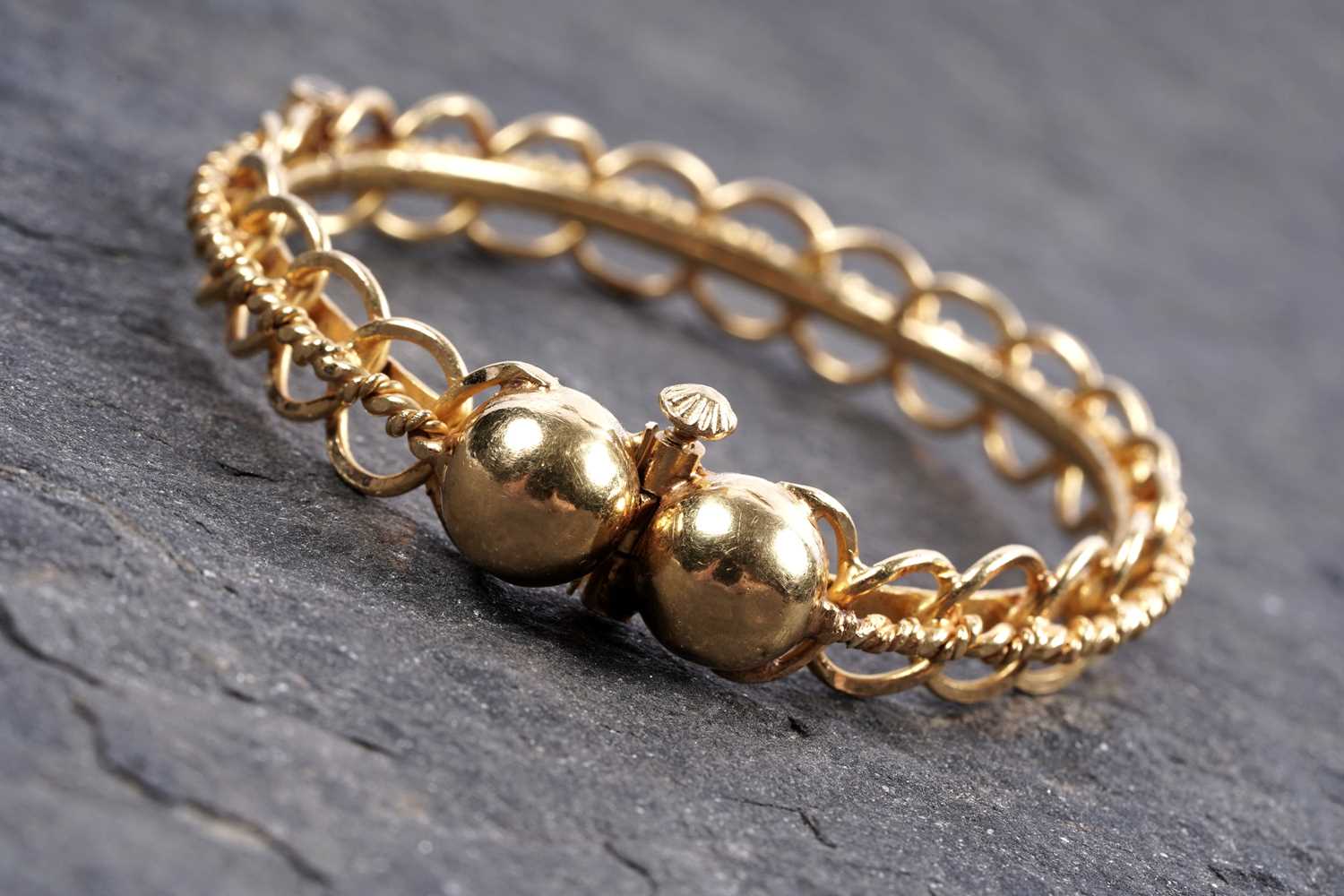 Lot 853 - A high carat yellow gold bangle