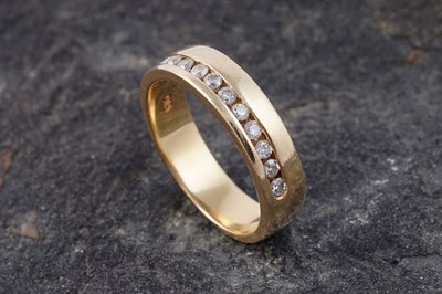 Lot 140 - A contemporary diamond half hoop eternity ring