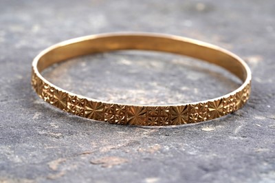 Lot 849 - A high carat yellow gold bangle