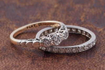 Lot 40 - A three-stone diamond ring; and a diamond eternity ring