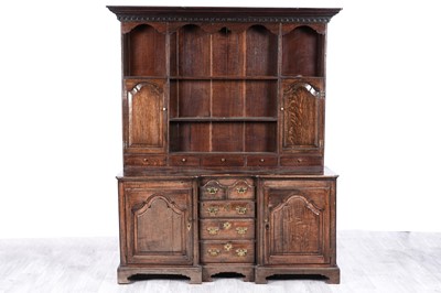 Lot 5 - A George III oak inverted breakfront dresser
