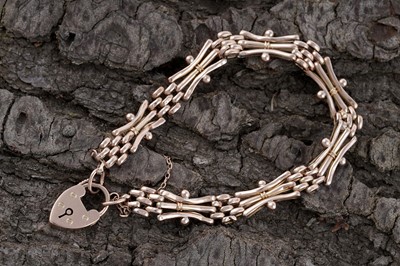 Lot 20 - An Edwardian 9ct rose gold fancy gate-link bracelet