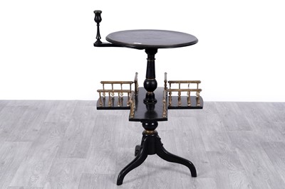 Lot 9 - A Victorian aesthetic movement ebonized and giltwood revolving bookcase/side table