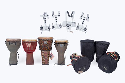 Lot 424 - Four assorted drums; and three marching band harnesses