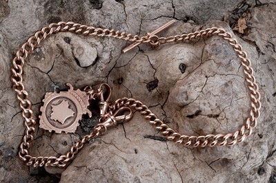 Lot 23 - An early 20th Century 9ct rose gold double "Albert" watch chain and fob