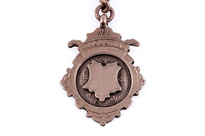 Lot 23 - An early 20th Century 9ct rose gold double "Albert" watch chain and fob