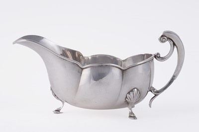 Lot 275 - An early George V Art Nouveau silver sauce boat
