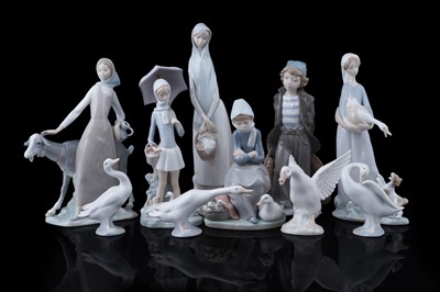 Lot 380 - A collection of nine ceramic Lladró figures; and another figure of a goose by Rex