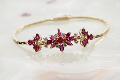 Lot 867 - A ruby and diamond bracelet