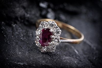 Lot 870 - A ruby and diamond cluster ring