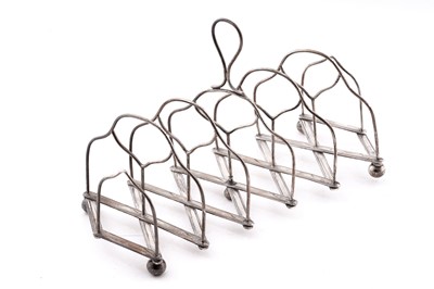 Lot 546 - A George III Scottish silver extending toast rack