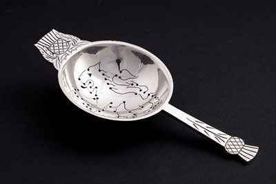 Lot 10 - A post war silver tea strainer