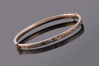 Lot 84 - An early 20th Century 9ct rose gold hinged bangle
