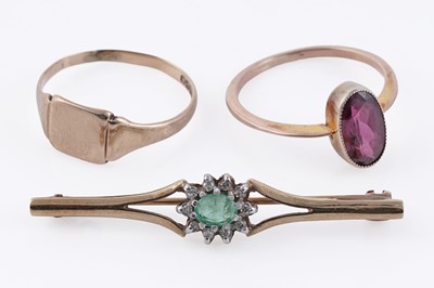 Lot 66 - An emerald and diamond cluster brooch; and two rings