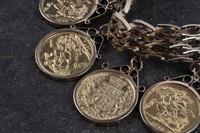 Lot 865 - A 9ct gold fancy-link bracelet set with ten gold sovereigns in fob mounts