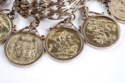 Lot 865 - A 9ct gold fancy-link bracelet set with ten gold sovereigns in fob mounts