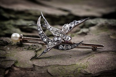 Lot 866 - A Victorian diamond swallow and crescent brooch