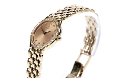 Lot 770 - Omega De Ville: an 18ct yellow gold diamond set lady's wristwatch