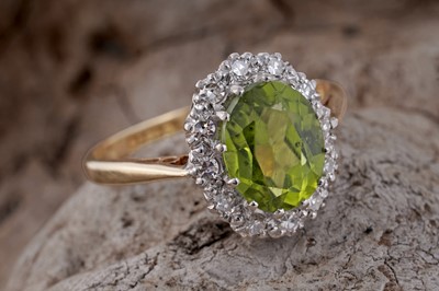 Lot 61 - A 1970's peridot and diamond ring