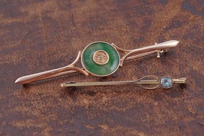 Lot 64 - A Chinese jadeite and 18ct gold bar brooch; and a 9ct gold bar brooch