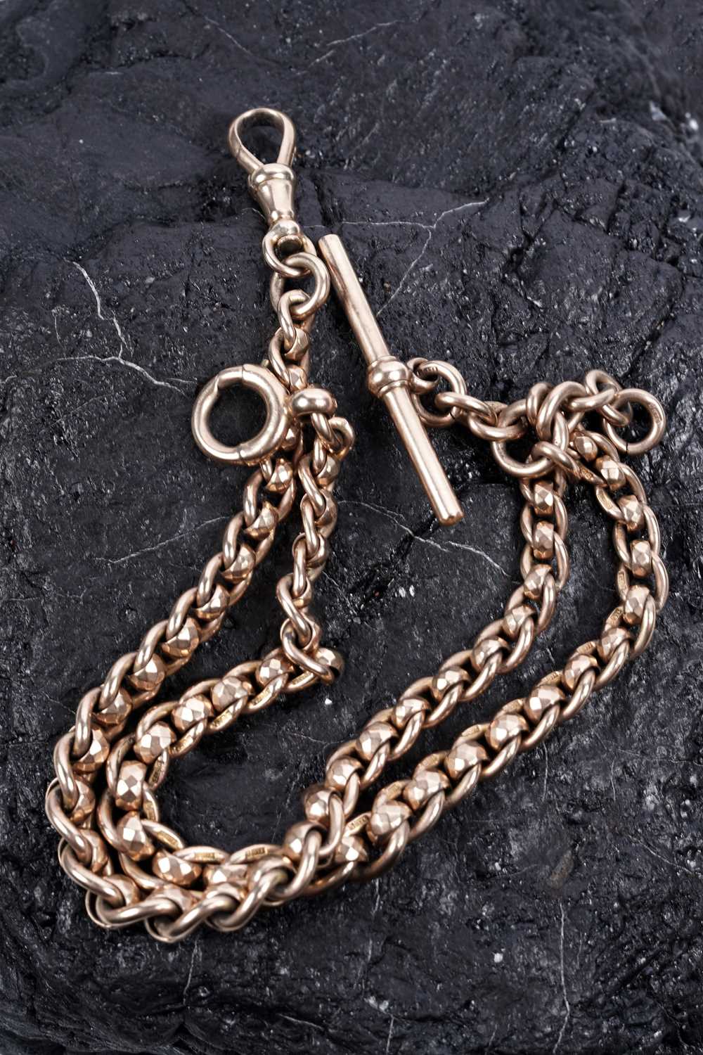 Lot 216 - A 9ct yellow gold watch chain
