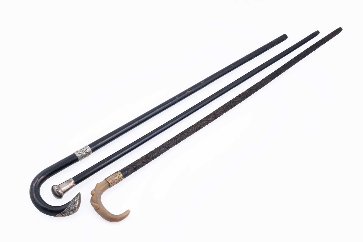 Lot 285 - A collection of three walking canes