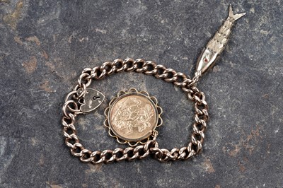Lot 217 - A 9ct yellow gold curb-link bracelet with sovereign; and an articulated fish pendant