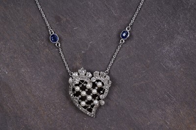 Lot 879 - An Edwardian diamond and pearl heart pendant