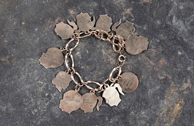 Lot 111 - A delightful and unique 1950's family record charm bracelet