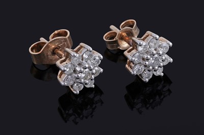 Lot 53 - A pair of diamond flowerhead pattern stud earrings