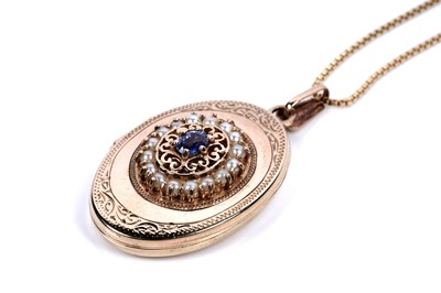 Lot 202 - A modern sapphire and seed-pearl mounted 9ct yellow gold locket pendant