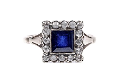 Lot 191 - A blue and white sapphire cluster ring