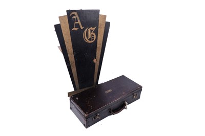 Lot 35 - A Buescher Aristocrat Low Pitch alto saxophone; and a painted plywood music bandstand