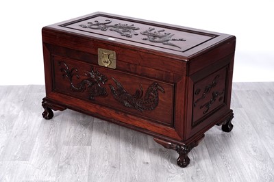 Lot 23 - A 20th Century Oriental carved hardwood camphor lined blanket box