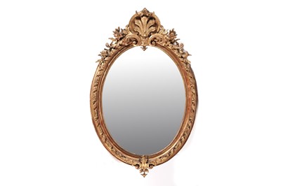 Lot 547 - A Victorian gilt and gesso oval mirror