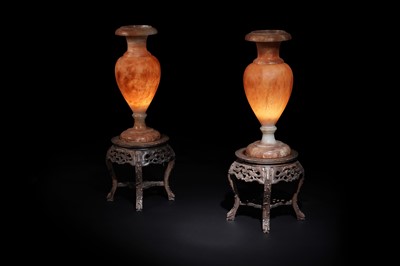 Lot 498 - A pair of early 20th Century Alabaster urns; and a pair of carved hardwood Chinese lamp stands