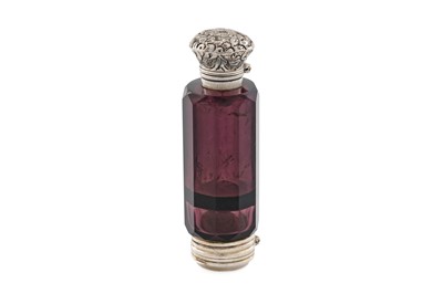 Lot 709 - A Victorian silver-gilt mounted amethyst coloured glass scent bottle and vinaigrette combined