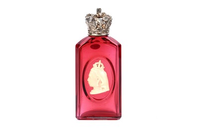 Lot 720 - A Victorian silver-gilt mounted cranberry glass scent bottle