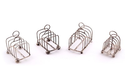 Lot 174 - Four silver toast racks