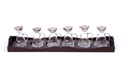 Lot 175 - An Edwardian matched set of six silver mounted glass whisky tots or chota pegs