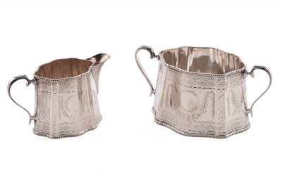 Lot 177 - An Edwardian silver cream jug and sugar basin