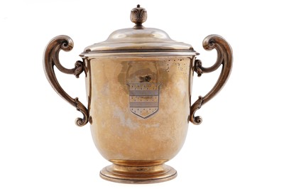 Lot 178 - An Edwardian silver-gilt cup and cover