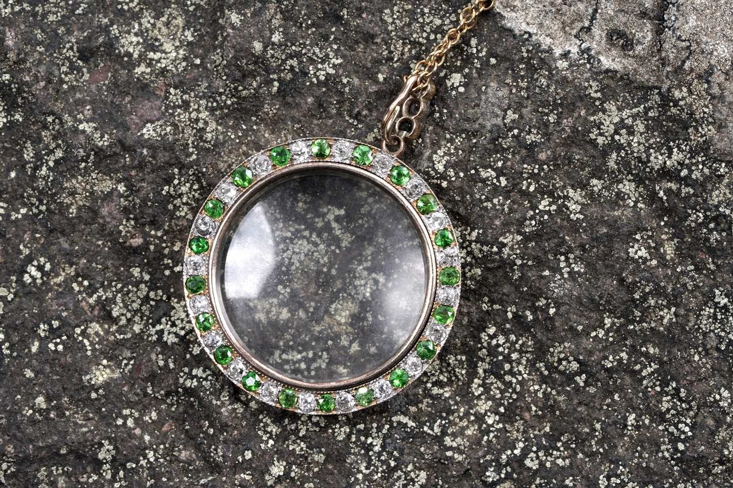 Lot 978 - An Edwardian demantoid garnet and diamond picture pendant