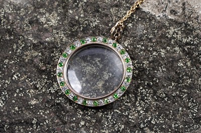 Lot 978 - An Edwardian demantoid garnet and diamond picture pendant